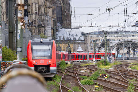 Cologne, Germany - July, 2021: S-Bahn regional suburban train S Bahn at Cologne K ln Hohenzollernbr cke. Germany regional speed trainsのeditorial素材
