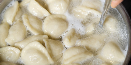 Meat Dumplings in boiling water. Meat dumplings are boiled in a pot of boiling water. Home fast foodの写真素材