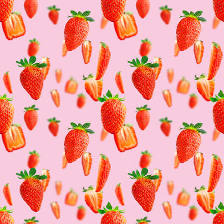 Fresh strawberry seamless pattern. Ripe strawberries isolated on pink. Package design background. Falling strawberry selective focus.の写真素材