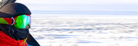 Teenager in alps. young boy in ski goggles at the ski resort. men in mountain goggles. reflection in...