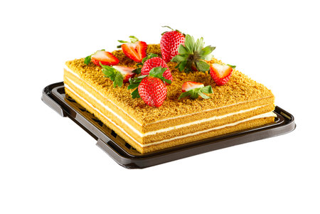 Honey cake dessert, square honey cake isolated on white background with berries