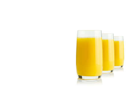 Organic Orange juice glass, isolated on white. Glass of fresh orange juice on white backgroundの写真素材
