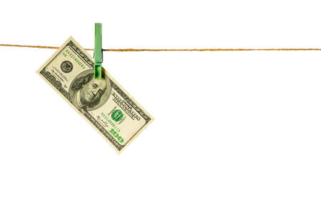 Money laundering. Dollar banknotes hanging on clothesline against white background. USD laundering concept.の写真素材