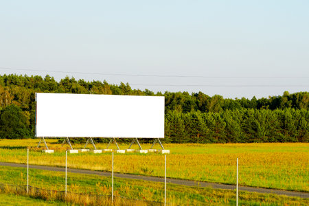 blank advertising billboard mockup. template for design. advertising billboard at sunset. large advertising road banner.の写真素材