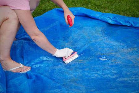 Cleaning pvc inflatable swimming pool, Cleaning the dirty empty pool of algae, The beginning of the...