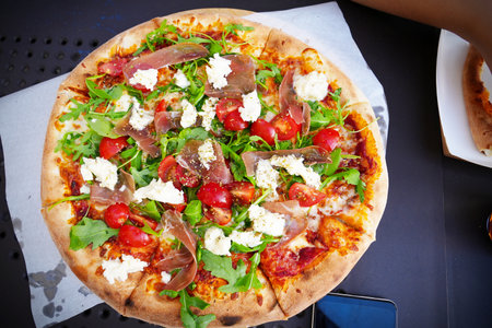 Pizza traditional and authentic Italian pizza baked. Pizza with mozzarella cheese, tomato sauce,...