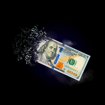 100 dollar bills scattered in the air. money inflation concept. the disappearance of banknotes,...