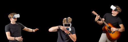Portrait of a young man with 3D virtual reality glasses. Young man using white virtual reality...