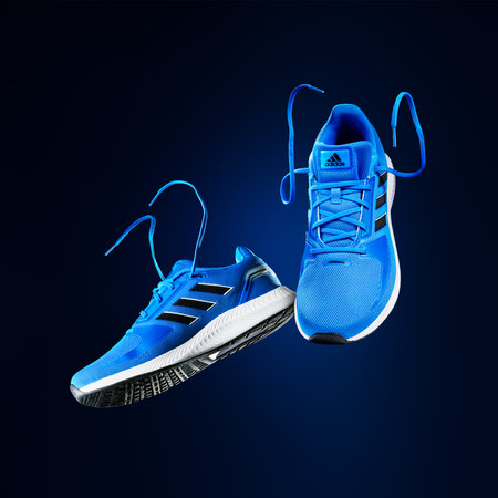 3.10.2022 Estonia, Tallinn: adidas runfalcon shoes. Adidas Running Shoes, orange blue color. Lightweight running shoes with style.のeditorial素材
