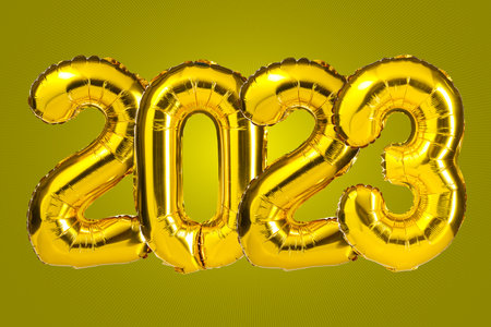 New Year 2023 celebration. Golden Yellow foil color balloons. 2023 balloons. On Yellow background....