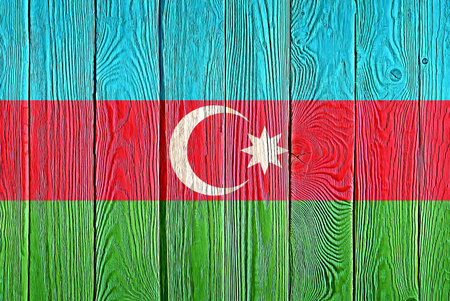 Azerbaijan flag painted on old wood plank background. Brushed natural wooden board texture. Wooden texture background flag of Azerbaijan.の写真素材