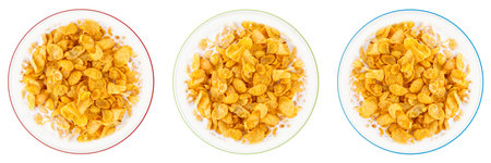 Bowl of sweet cornflakes with milk isolated on white background, top view