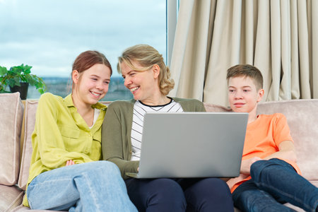 Happy Family on couch using gadget. Rest at home. Using Digital devices at home