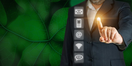 Businessman touching screen for contact us information. Contact us concept.の写真素材
