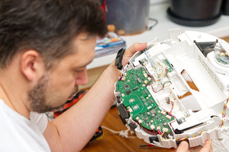 home electronics repair concept. vacuum robot cleaner service centerの写真素材