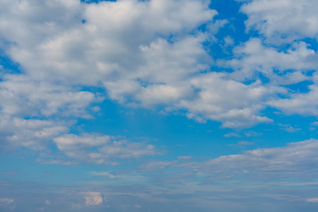 Blue Sky with Lots of White Clouds: Background for Replacement or Inspiring Ideasの写真素材