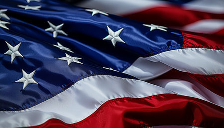 Patriotic american flag waving gracefully in the wind on independence day, full frame shotの素材