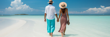 Silhouetted couple enjoying a vibrant summer day at the beach with serene ocean wavesの素材