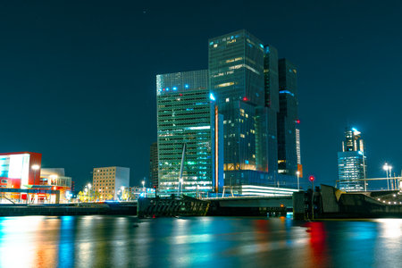 Magnificent Nocturnal Scenery of Rotterdams High-Rise Architecture and Starry Night Skyの写真素材