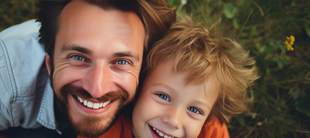 Enjoying quality time at home  joyful father and son bonding, smiling and playing togetherの素材