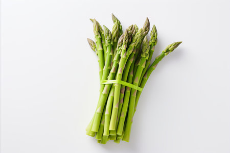 Fresh green asparagus on clean white backdrop for captivating ads and packaging designsの素材