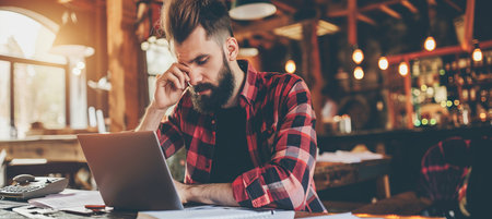 Financial crisis  stressed caucasian man calculating expenses, facing debt and bankruptcyの素材