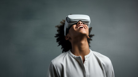 Young man wearing virtual reality headset, experiencing futuristic technology conceptの素材