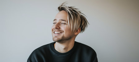 portrait of a handsome blonde scandinavian man smiling with clean teeth   dental advertisementの素材