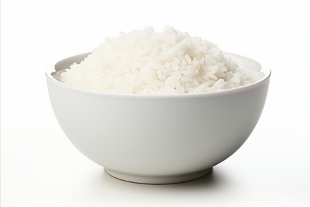 Heap of freshly cooked white rice grains isolated on a clean white backgroundの素材