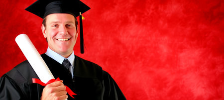 Proud graduate with diploma on red backdrop   ideal for advertising with text spaceの素材