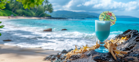 Refreshing blue lagoon cocktail in tropical paradise with blurred beach background and copy spaceの素材