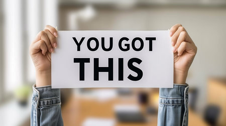 Motivational success concept  woman holding  you got this  sign on blurred backgroundの素材