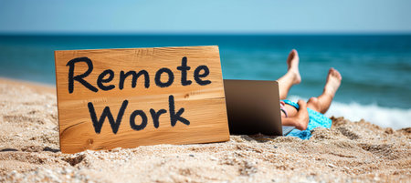 Remote work concept with man working on laptop from beach  amp  remote work signの素材