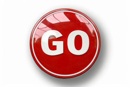 Round button with bold  go  text isolated on pure white background for design projects.の素材