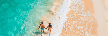 Couple walking on white sandy beach, tropical paradise island, space for text placementの素材