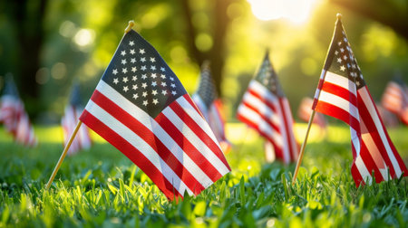 Honoring american veterans on memorial day at national cemetery with american flagsの素材