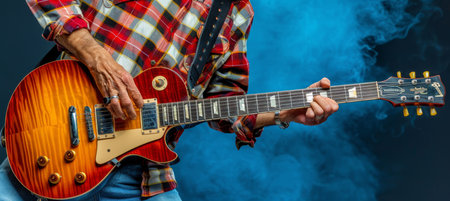 Closeup of guitarist in studio passionately playing a song for a captivating performanceの素材