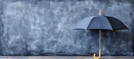 Umbrella providing shelter in rain with space for text placement, ideal rainy weather conceptの素材