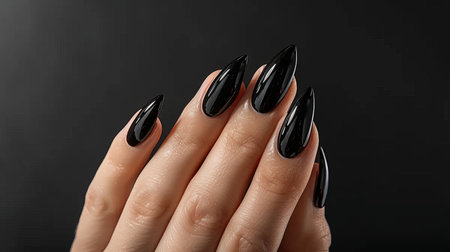 Close up shot of elegant woman s hand with stylish black nail polish, glamorous and captivatingの素材