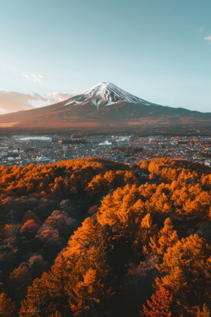 Mtfuji  tallest volcano in tokyo, japan with snow capped peak and autumn red trees landscapeの素材