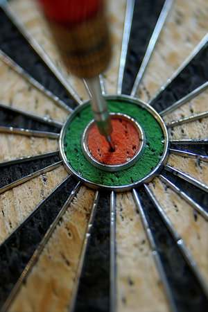 Red dart hits bullseye, symbolizing business success, investment goal, opportunity challengeの素材