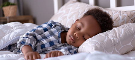 Tranquil african newborn baby peacefully sleeping on a beautifully adorned white bedの素材