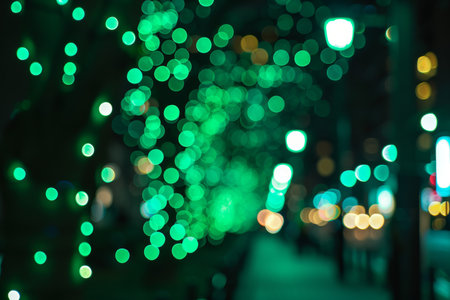 Captivating abstract green bokeh lights defocused for stunning background imageryの素材