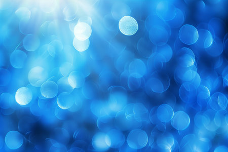 Abstract blue bokeh lights background with blurred defocused effect for artistic designsの素材