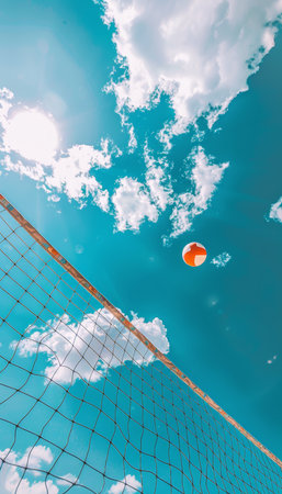 Beach volleyball  ball and net under clear blue sky   summer seascape recreation conceptの素材