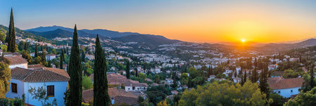 Golden Sunset over a Picturesque Spanish Town A scenic panorama of traditional architectureの素材