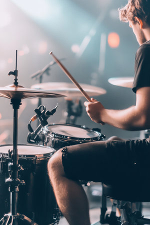 Drummer In Action, Playing Drums On Stage With Passion And Energy, Live Music Performanceの素材