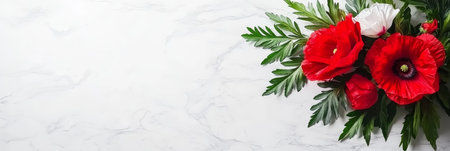 Red Poppies, White Ranunculus, and Fresh Green Fern Branches on a White Marble Backgroundの素材