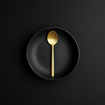 Elegant Minimalist Black Round Plate With Golden Spoon, Top View, Flat Lay, Copy Spaceの素材