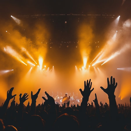 Live Music Concert, Energetic Crowd with Raised Hands, Bright Stage Lights, Festive Atmosphereの素材